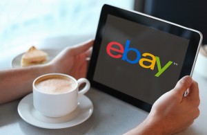 Man holding tablet computer in cafe. Close up